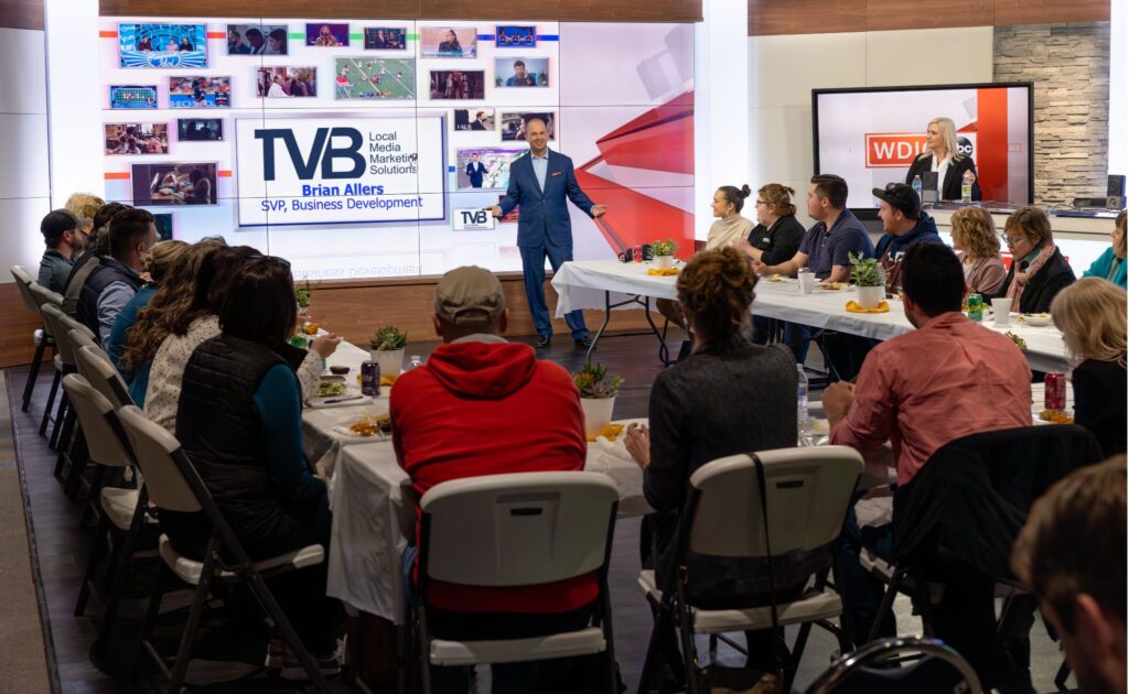 A group of students sitting around a table during a TVBU class.