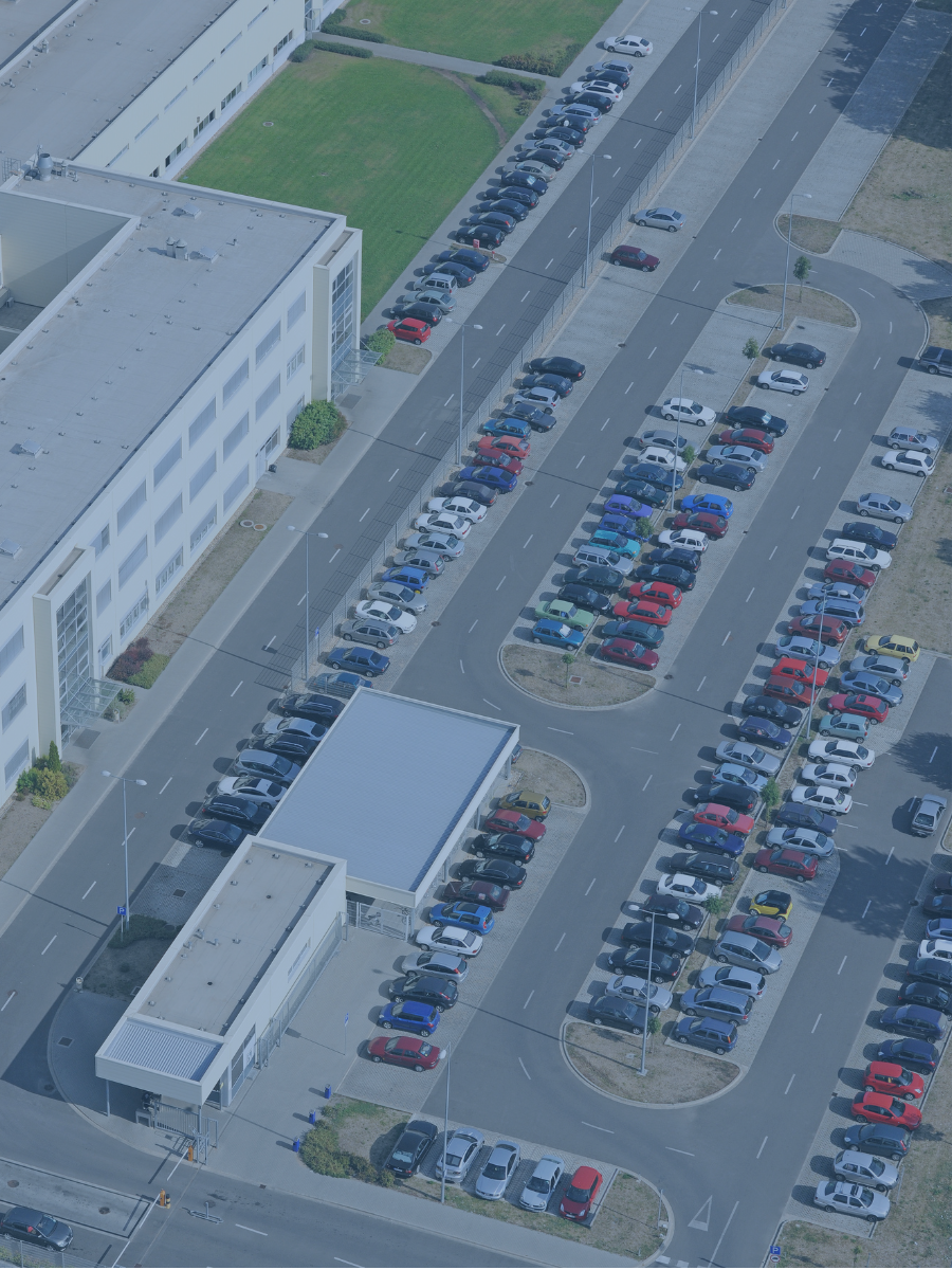 Overhead view of an automobile sales lot.