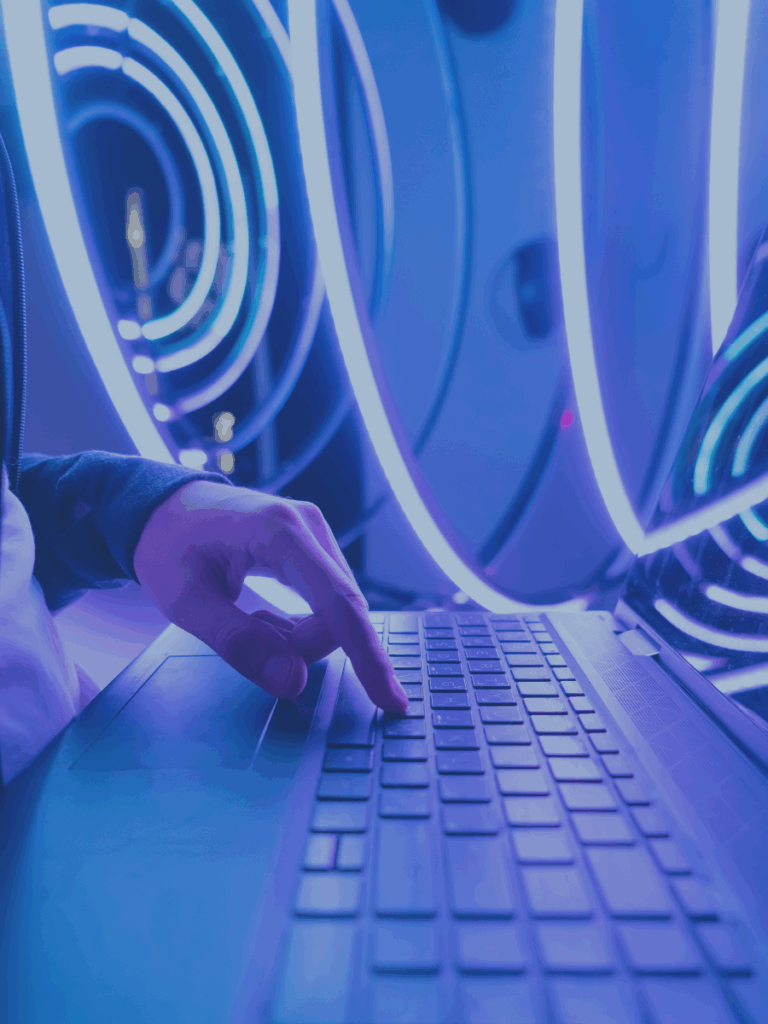 Futuristic, tech-forward vibe for an AI webinar with swirling blue and purple light rings on a hand on a keyboard.